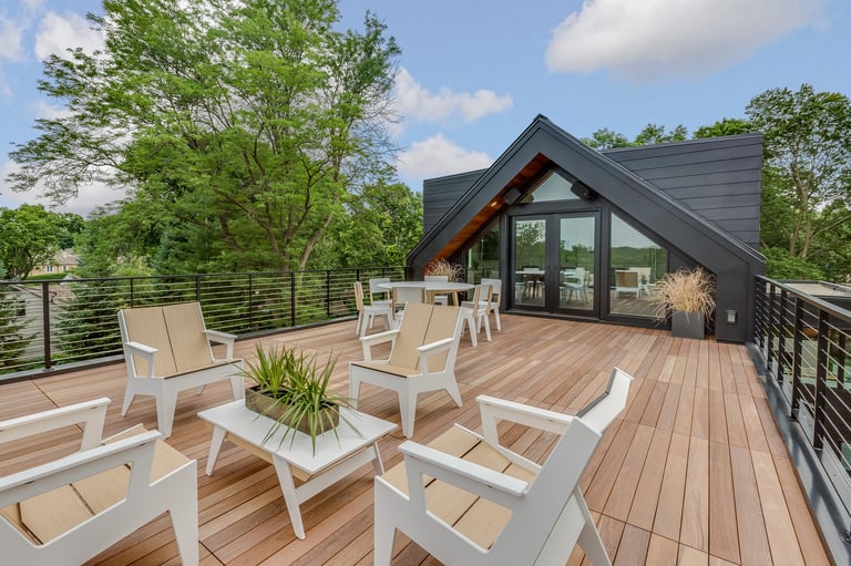 Newly built home with wood deck on a sunny day